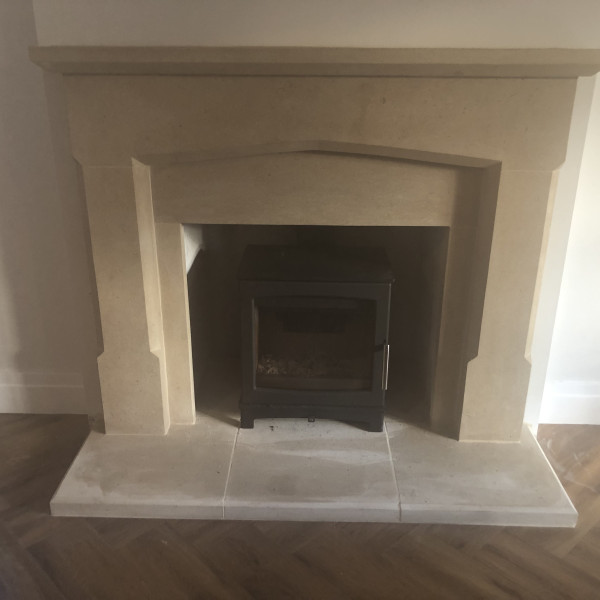 Bath stone fireplace installation of made to measure surround