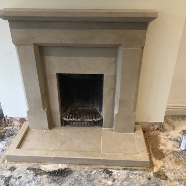 Hand carved Bath stone fireplace with kerb hearth edging