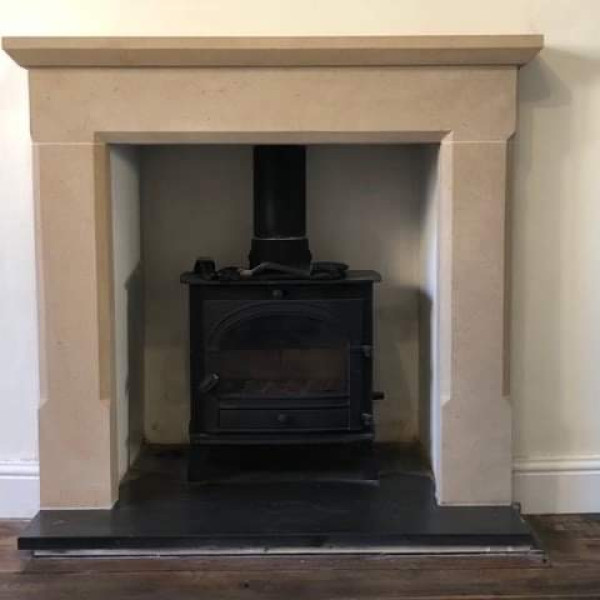 Stone fireplace carved and fitted