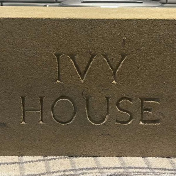 Stone house plaque carved this week