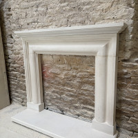 Hand carved solid natural English stone surround fireplace complete with outer hearths in stone or riven slate The Tanzanite